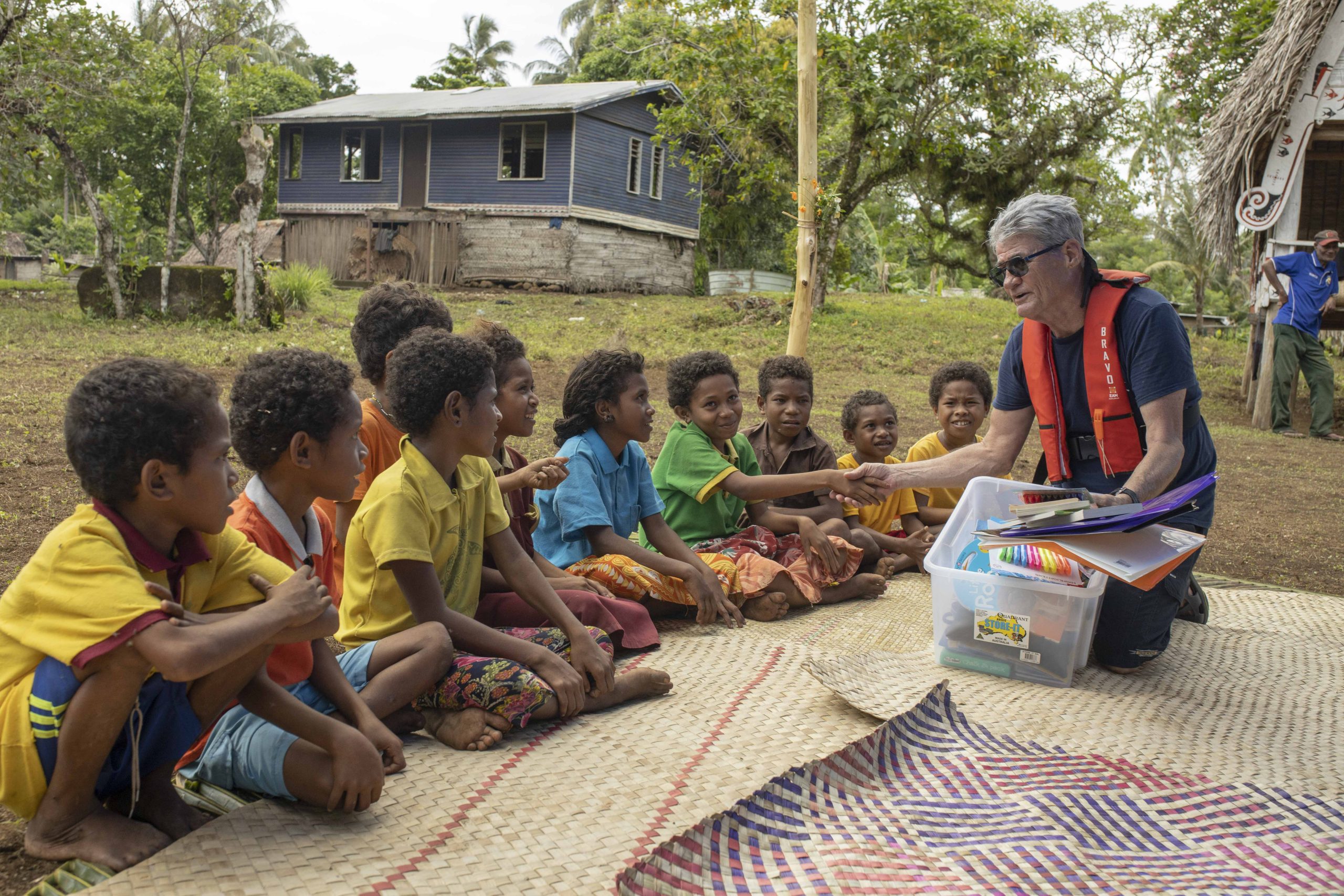 Agent Image Gallery 105 Tourist Donating Pens and Books True North Cruise PNG
