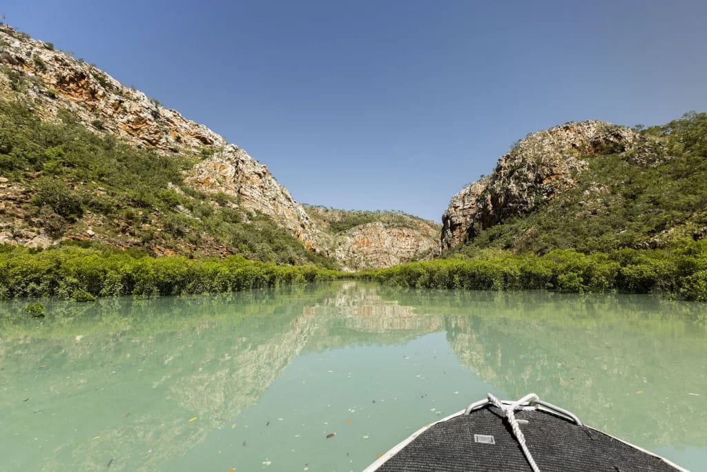 Adventure boat entering a remote Kimberley gorge – tender boat benefits enable access to hidden waterways