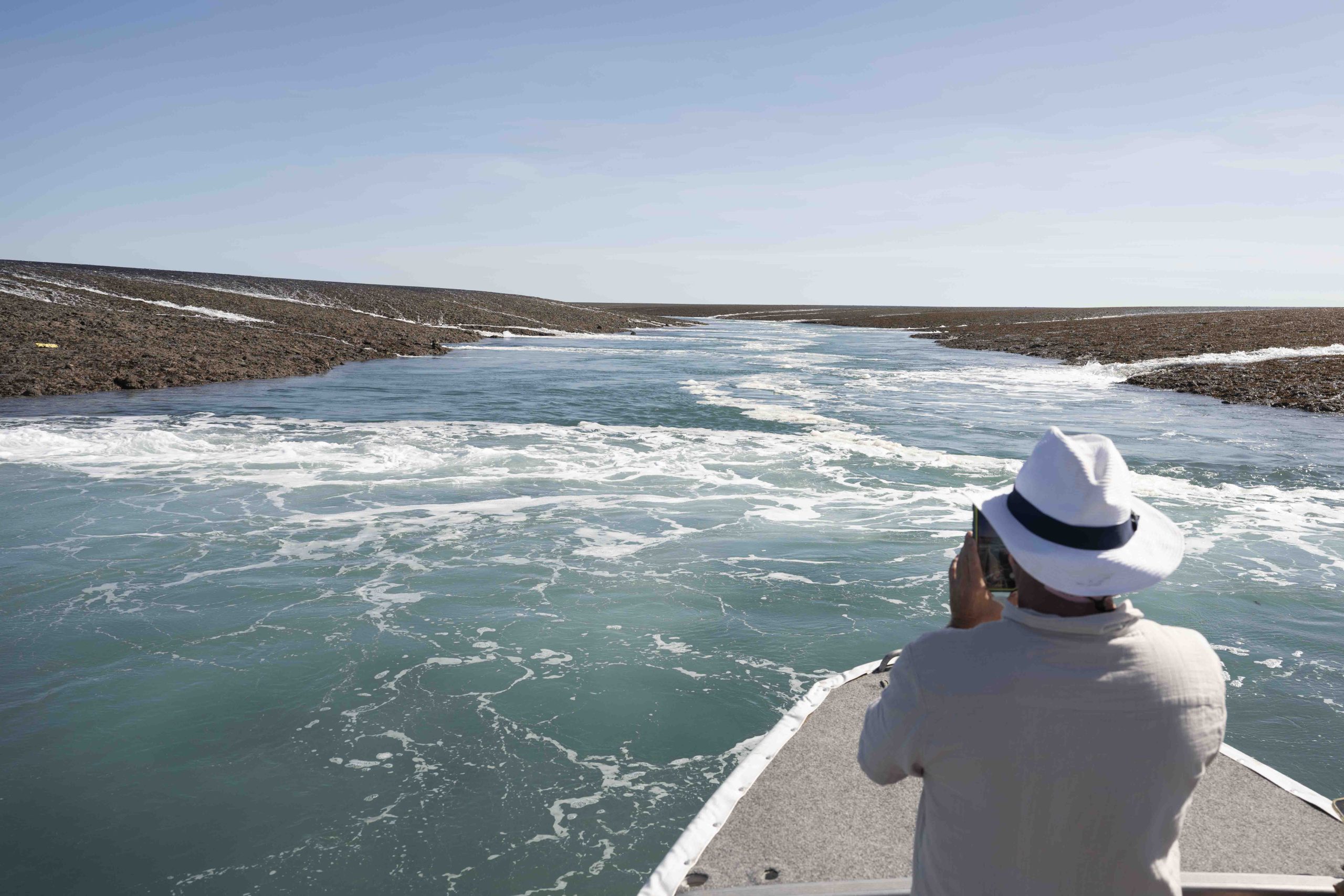 True North guest photographing the tidal currents at Montgomery Reef in the Kimberley, Western Australia